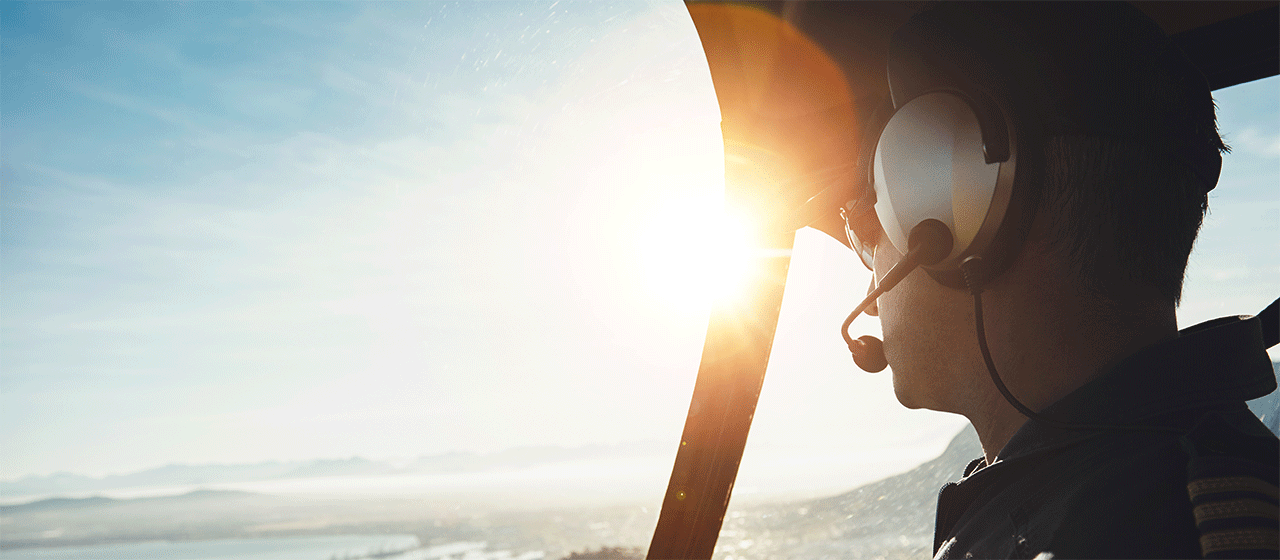 pilot in aircraft overlooking the horizon